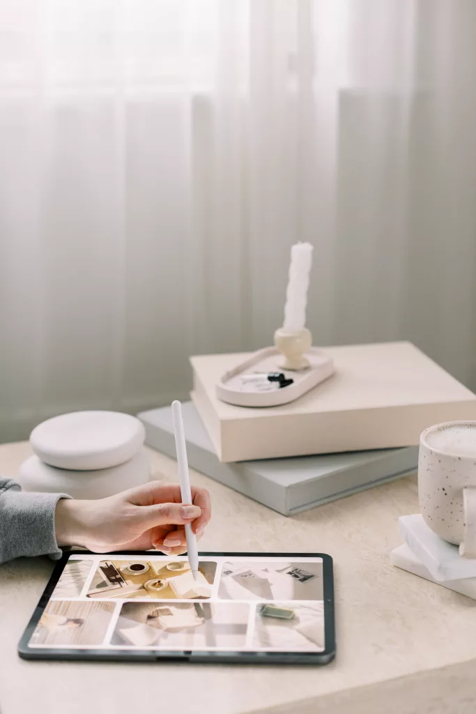 Woman writing with Apple pen on iPad. Marketing agency. Web design. Marketing Your Brand, Australia.